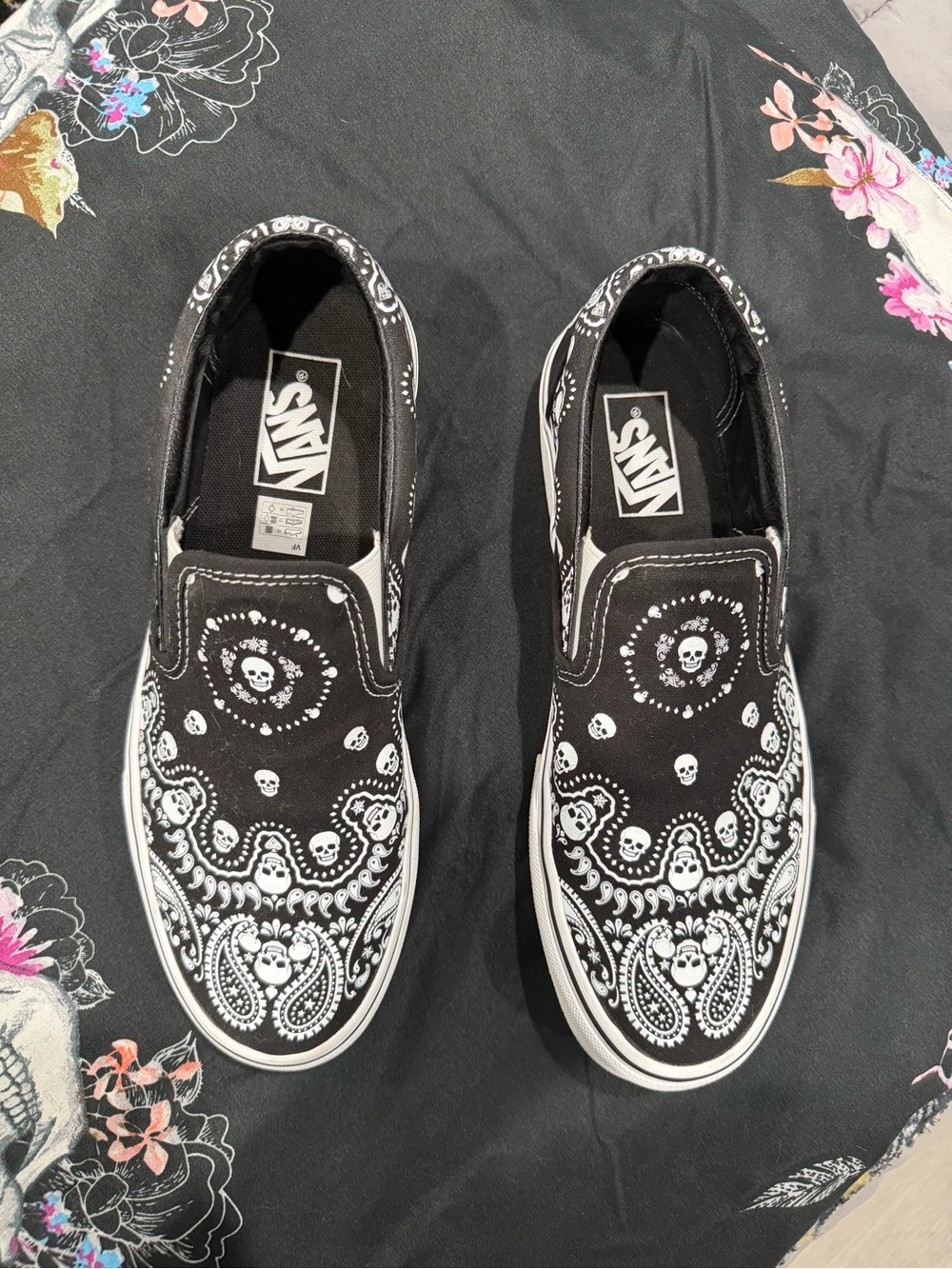 Vans Black and White Slip-On Flats with Skull Bandana Print